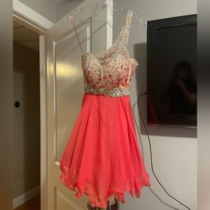 Blush homecoming party dress with jewels on bodice.